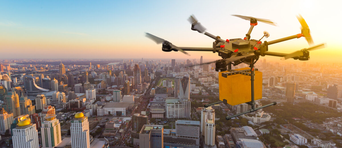Drone transport flying with cardboard box above city, futuristi
